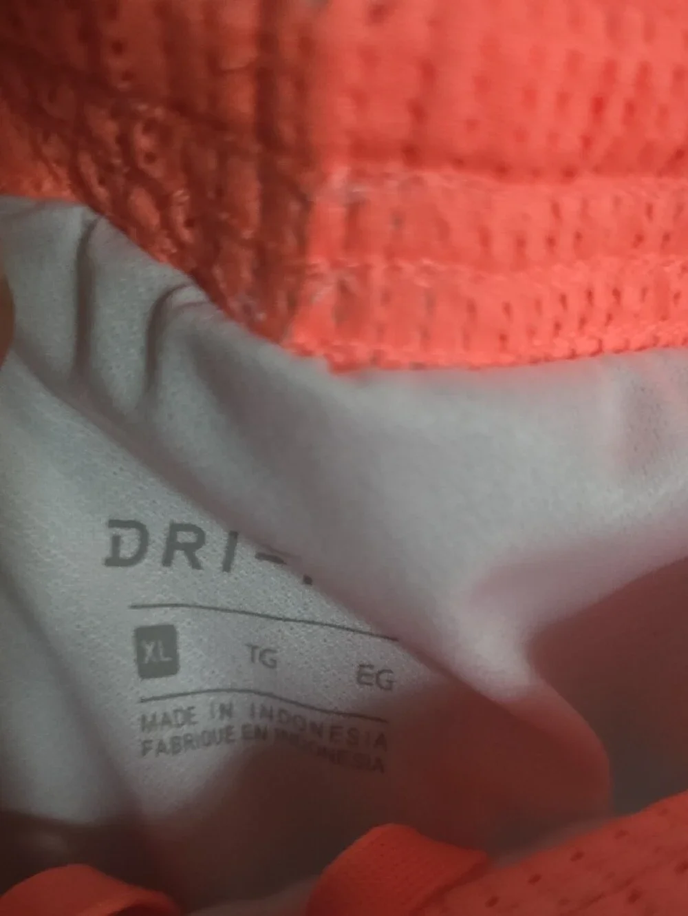 Nike Women’s White Athletic Shorts with Neon Coral Accent